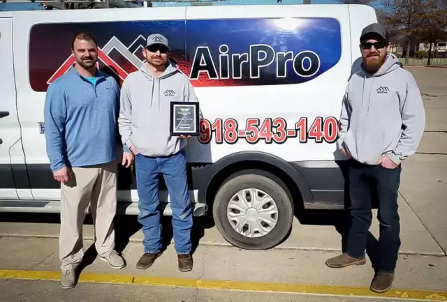 Shane & Dustin, Owners Of AirPro Heating Cooling & Construction, with a technician and their American Standard Sales Award