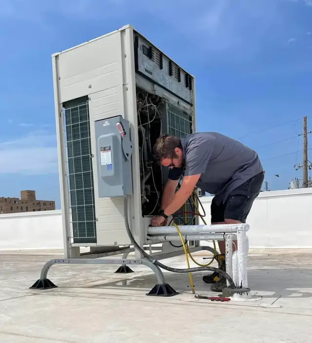 Hard at work on this rooftop.