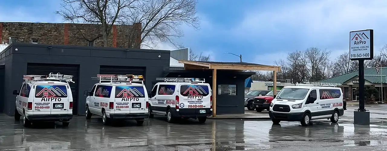 The fleet of service vans in front of the AirPro office.